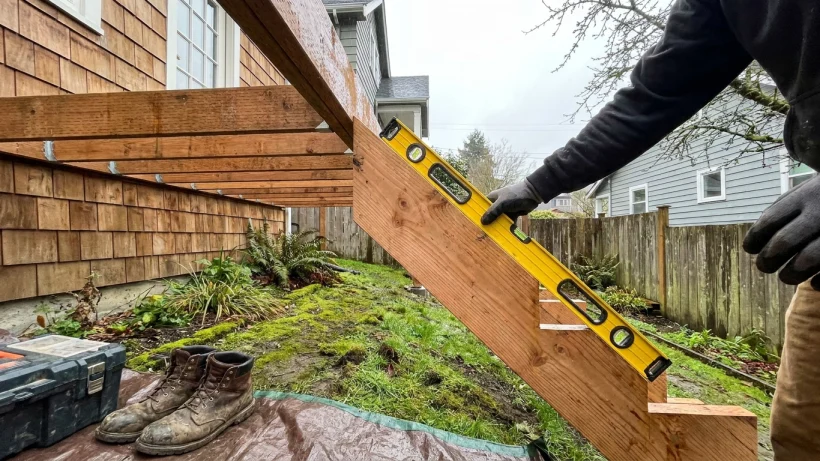 Start with the site: grade, water, and the home's doorway