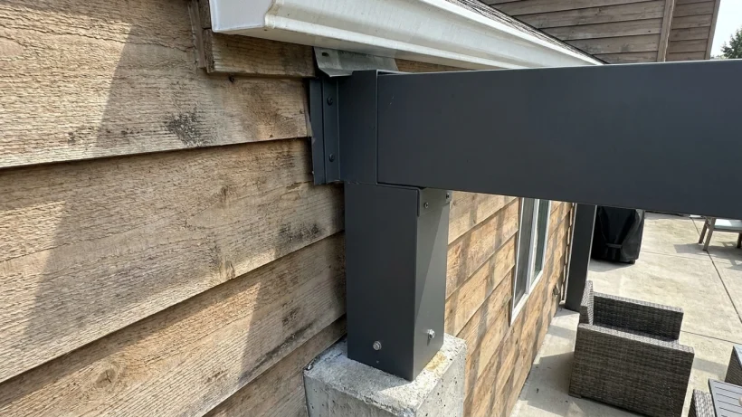 What supports the cover, and how will it attach to the house?